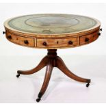 A regency sycamore and mahogany drum-top revolving library table