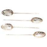 A selection of silver mote spoons,