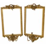 A pair of gesso framed wall mirrors