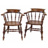 A pair of late 19th-century oak and elm club chairs