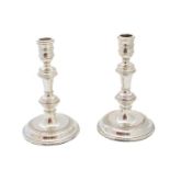 A pair of Elizabeth II silver candlesticks,