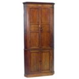 George III mahogany double floor standing corner cupboard