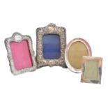 Four silver picture frames,