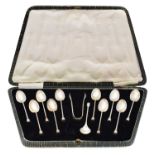 A cased set of George V silver teaspoons and sugar nips,