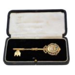 An early 20th century silver gilt presentation key,