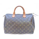 A Louis Vuitton monogram Speedy 30 handbag,