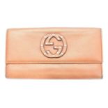 A Gucci logo trifold long wallet,