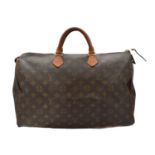 A Louis Vuitton monogram Speedy 40 handbag,