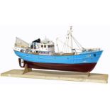 Scale model of a fishing trawler.