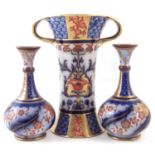 Matched garniture of three Macintyre vases,