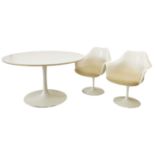 Eero Saarinen design dining table and seven armchairs