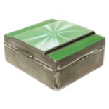 An early 20th century silver and enamel cigarette box,