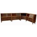 Four walnut finished wall units by Greaves and Thomas