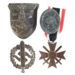 Three German Third Reich badges and a medal