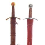 Two modern replica swords and scabbards.