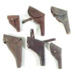 Six various leather pistol holsters