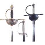 Two modern replica rapiers and a court sword