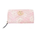 A Gucci Marmont zip around wallet,