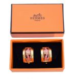 A pair of Hermes logo ribbon earrings,