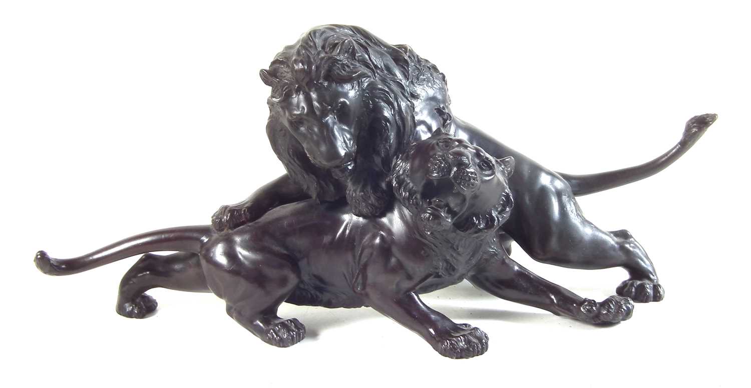 Twentieth century Japanese bronze model of a lion attacking a tiger.