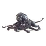 Twentieth century Japanese bronze model of a lion attacking a tiger.