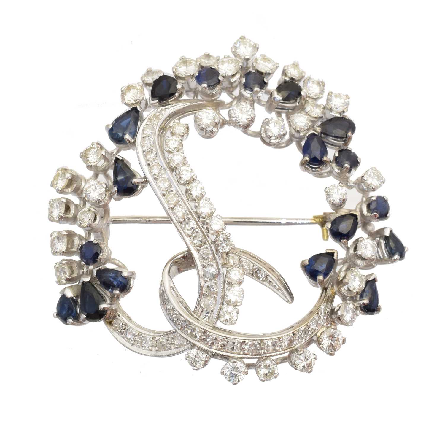 A sapphire and diamond brooch,