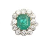 An emerald and diamond cluster ring,