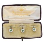 A cased set of early 20th century enamel and mother of pearl dress studs,