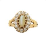 A Victorian 18ct gold cat's eye chrysoberyl and diamond cluster ring,