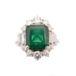 An emerald and diamond cluster ring,