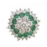 An emerald and diamond cluster ring,