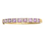 A 9ct gold amethyst and diamond hinged bangle,