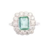 An emerald and diamond cluster ring,