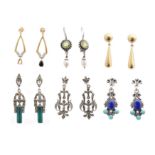 A selection of gold and silver earrings,