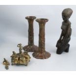 A carved wooden model, of a kneeling female, height 10ins, together with a pair of Oriental metal