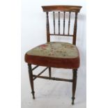 A 19th century child's chair, with turned spindle back, a floral tapestry seat, on turned front