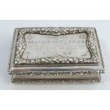 A 19th century silver table snuff box, of rectangular form, with raised floral border, the top