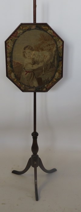 A 19th century mahogany pole screen, the octagonal screen decorated with a tapestry panel of a