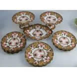 A Royal Crown Derby porcelain part dessert service, decorated in the Imari palette with shaped edge,