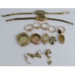 A collection of 9 carat gold items comprising five rings, four watch cases, a watch bracelet,