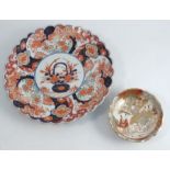 A 19th century Imari dish, decorated in the typical palette with flowers, diameter 12.25ins,