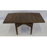 A 1930's oak child's nursery draw leaf dining table