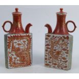 A pair of late 19th century Satsuma tea pots, of triangular form, decorated with a phoenix, a dragon