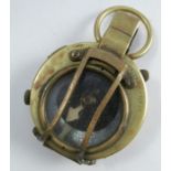 A WWII Military issue brass cased compass, engraved 1918 E. Koehn Geneve Suisse No. 137786, Verner’s