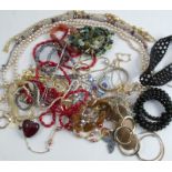 A collection of assorted costume jewellery and some ladies wrist watches