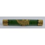 A nephrite bar brooch, the mounts stamped '9c', 6g gross