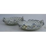 A pair of first period Worcester oval pierced baskets, decorated in blue and white with flowers,
