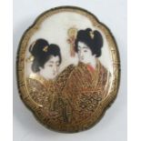 A Satsuma pottery plaque, mounted for a buckle, Meiji period, decorated with two portraits of