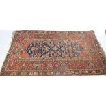 An Eastern design rug, decorated with flower heads and other repeating motifs, 89ins x 48ins