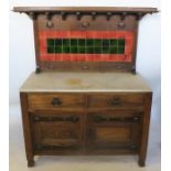 A Shapland and Petter style oak Arts and Crafts wash stand, with tile set back, the base with marble